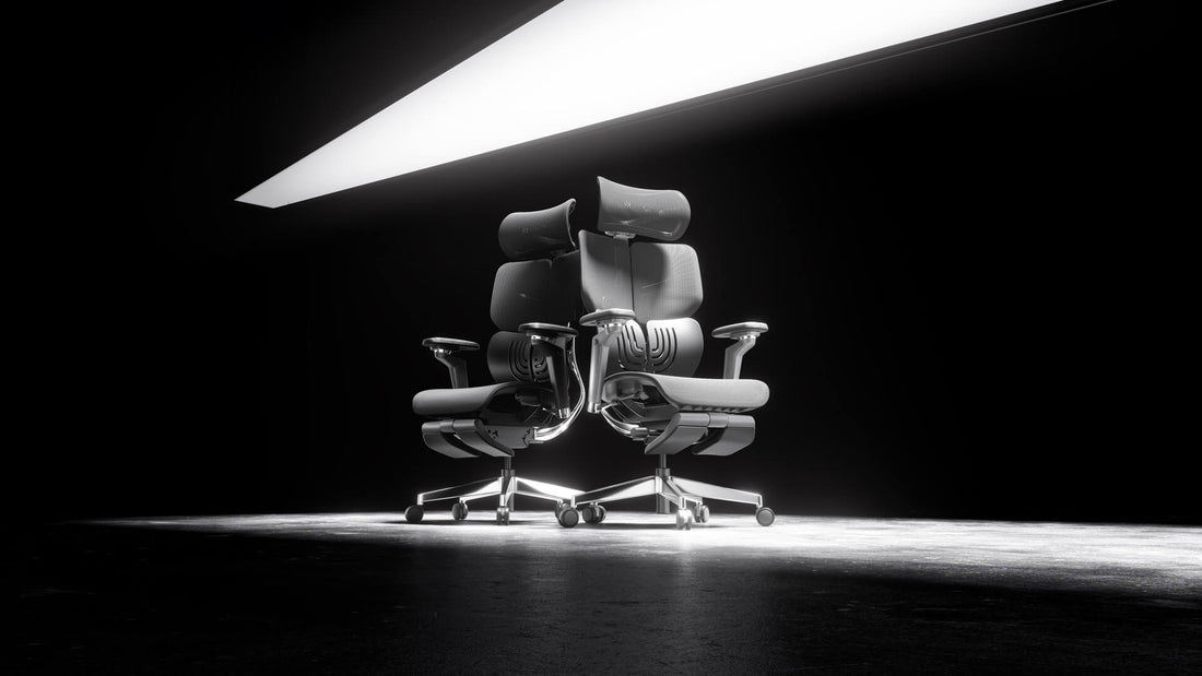 Pair of sleek X1 ergonomic office chairs under a spotlight in a dark setting.