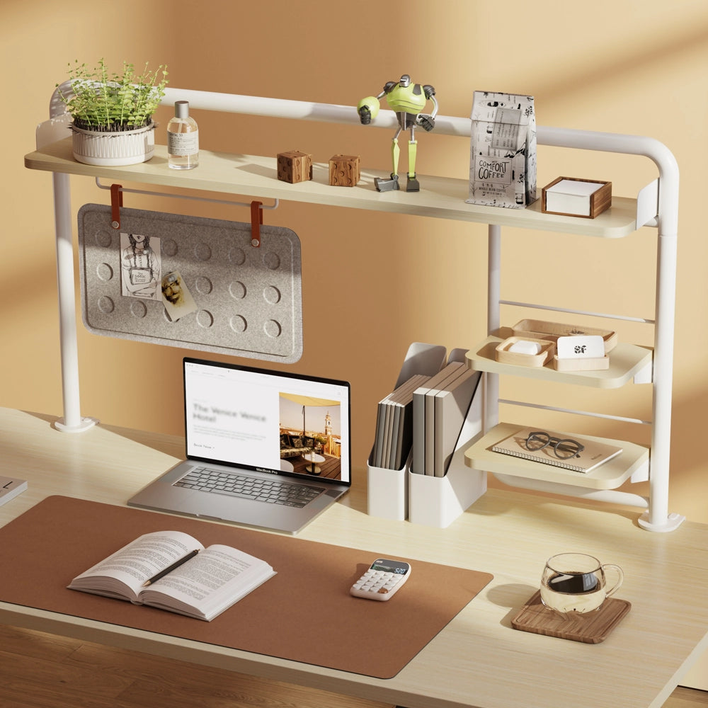 Organized desktop setup featuring a multifunctional Hinomi clamp-on desk shelf with books, plants, and accessories for an efficient workspace.”